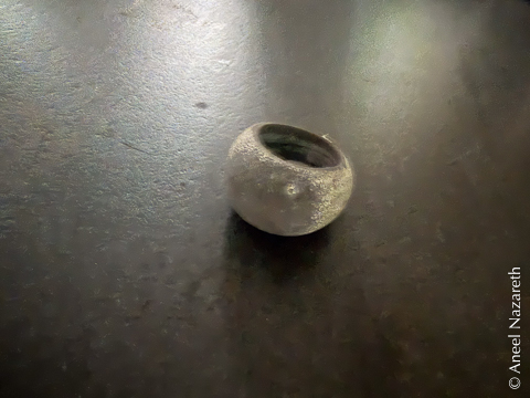 The cast version of the ring has a strange dark cast to the dome and an almost powdery surface